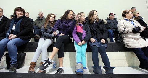 PHIL HOSSACK / WINNIPEG FREE PRESS Girls Night out, Mom Ramona Thomson points out some good hockey action to her daughters (L-R) Kate (11), Macy (8), and Ella (14) Thursday evening at the Ice Plex during World Sport School Challenge. See Tim Campbell story.  March 10, 2016