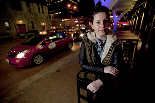 PHIL HOSSACK / WINNIPEG FREE PRESS Jenn Zoratti poses before hiring a Cab downtown Thursday evening. See her story.   March 10, 2016