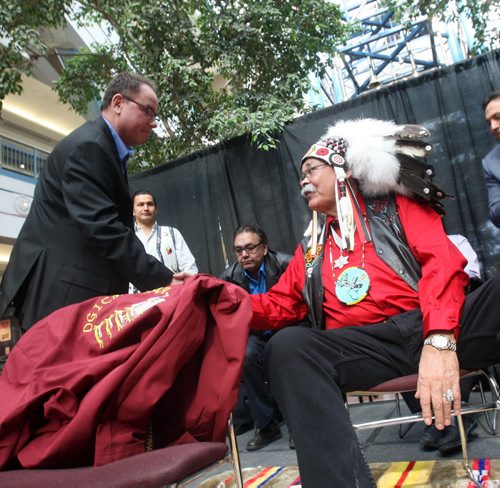 JOE BRYKSA / WINNIPEG FREE PRESS Veteran - Elder Joseph Meconse was kicked out of Portage Place in Feb of this year, today there was a gathering in the mall to honour the elder- Here Portage Place general manager David Stone shakes - Elder Joseph Meconse after formal apology-  March 11, 2016.(See Jen Zoratti story)