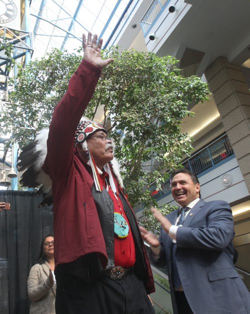 JOE BRYKSA / WINNIPEG FREE PRESS  Veteran - Elder Joseph Meconse was kicked out of Portage Place in Feb of this year, today there was a gathering in the mall to honour the elder- Here  he salutes crowd in Mall next to AFN National Chief Perry Bellegarde -  March 11, 2016.(See Jen Zoratti story)