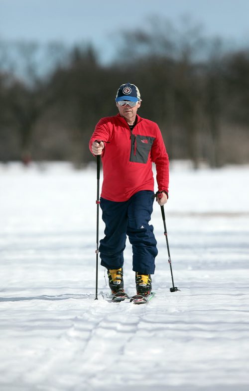 PHIL HOSSACK / WINNIPEG FREE PRESS Prepping for a training session, Kent Ulrich strides across Assinaboine Park Friday afternoon.  Story: Kent will travel to the Alps next week to take on a gruelling ski tour. He's been training for a while now. The trip will not only be a physical challenge, it will be emotional. That's because Kent plans to take his mother's ashes with him a spread them from atop an alpine glacier. Shamona Harnett story. March 11, 2016