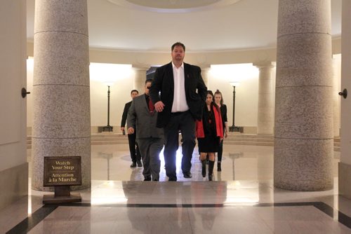 RUTH BONNEVILLE / WINNIPEG FREE PRESS  A group of Liberal candidates, led by St. Johns candidate Noel Bernier, make their way across the - pool of the black star room on the main level of the Manitoba Legislative building to talk to a press conference speaking out against Wab Kinew's  tweets Friday.    March 11, 2016