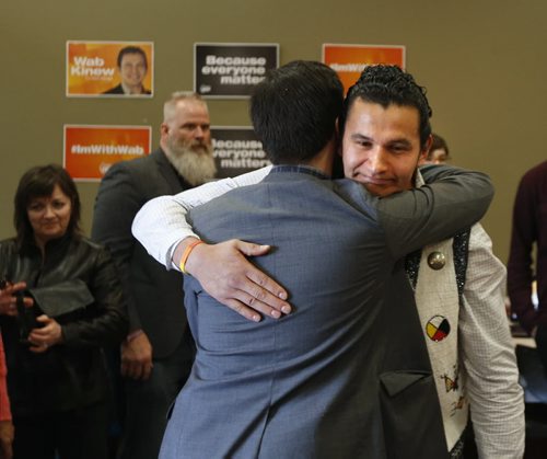 WAYNE GLOWACKI / WINNIPEG FREE PRESS  At right, Wab Kinew, NDP candidate for Fort Rouge gets a hug after the news conference in his campaign office Friday with Premier Greg Selinger and supporters. Gord Sinclair/ Kristin Annable stories   March 11 2016