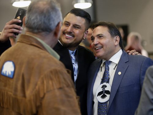 WAYNE GLOWACKI / WINNIPEG FREE PRESS   In centre, Rocky Dhillon, pres. Automotive Source of Canada snaps a picture with Perry Bellegarde, National Chief Assembly of First Nations at right at the Manitoba Chambers of Commerce luncheon Friday. Perry was the keynote speaker at the event. Bill Redekop March 11 2016