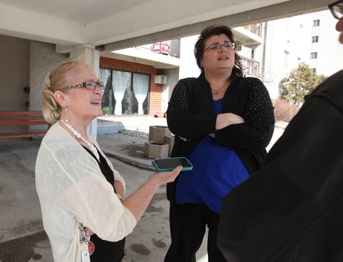 RUTH BONNEVILLE / WINNIPEG FREE PRESS  St. Vital PC candidate, Colleen Mayer with her campaign manager Pat Rondeau next to her answers questions from the press on allegations about using Green Team employees to plant flowers at her home residence outside a seniors complex in St. Vital Friday.    March 11, 2016