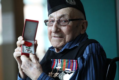 RUTH BONNEVILLE / WINNIPEG FREE PRESS  HONOURING A HERO -- 2nd World War Veteran, Mr. John Johnson, holds the Legion of Honour Medal at Deer Lodge Hospital where he was presented with the medal at formal ceremony Saturday.   See Kevin Rollason's story.  March 12, 2016