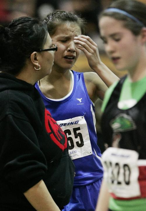 John Woods / Winnipeg Free Press / February 29, 2008- 080229  - Tamara Watcheson (1565) from Queen City Striders gets emotional with her coach after crossing the finish line in the Women 1500m Bantam Finals at the 2008 Boeing Indoor Classic at the U of Manitoba Friday February 29/08.