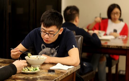 TREVOR HAGAN / WINNIPEG FREE PRESS Restaurant Review - Dancing Noodle. Customers eating in the dining room. Chef Xiaofei Zuo makes noodles by hand and to order, Saturday, March 12, 2016. - FOR BART KIVES REVIEW