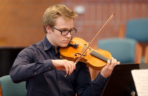 TREVOR HAGAN / WINNIPEG FREE PRESS Peter Bell-Scholz, a member of Quantum Quartet, a string chamber group, performing at Young United Church during the Winnipeg Music Festival, Friday, March 11, 2016.