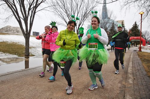 MIKE DEAL / WINNIPEG FREE PRESS  Joggers dressed in lucky green take part in the St. Paddy's Day run/walk at The Forks Sunday morning    160313 Sunday, March 13, 2016