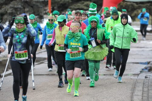 MIKE DEAL / WINNIPEG FREE PRESS  Joggers dressed in lucky green take part in the St. Paddy's Day run/walk at The Forks Sunday morning    160313 Sunday, March 13, 2016