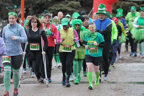 MIKE DEAL / WINNIPEG FREE PRESS  Joggers dressed in lucky green take part in the St. Paddy's Day run/walk at The Forks Sunday morning    160313 Sunday, March 13, 2016