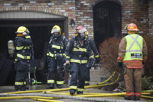 JOHN WOODS / WINNIPEG FREE PRESS Fire crews attend a fire at 38 Matlock Cresent Sunday, March 13, 2016.