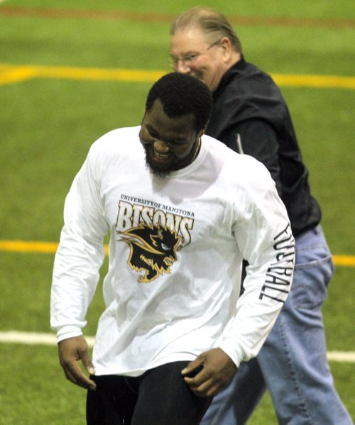 BORIS MINKEVICH / WINNIPEG FREE PRESS Bison David Onyemata pro day football workout at the University of Manitoba. Onyemata is the first Manitoba Bisons to hold a pro day football workout.  At least 12-16 NFL scouts and coaches were there. In this photo New Orleans Saints defensive line coach Bill Johnson and David share a laugh. Photo taken March 14, 2016