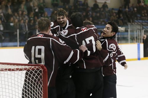 JOHN WOODS / WINNIPEG FREE PRESS St Paul's Crusaders celebrates defeating Vincent Massey Trojans at the Provincial High School AAAA final Monday, March 14, 2016 at St James Civic Centre.
