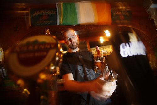 JOHN WOODS / WINNIPEG FREE PRESS Bartender Andrew Webb pulls a pint at Shannon's Irish Pub on Carlton Monday, March 13, 2016. Re: Sanderson