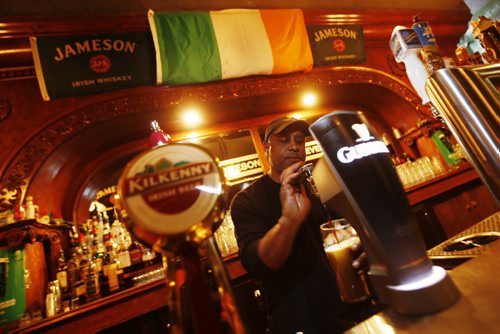 JOHN WOODS / WINNIPEG FREE PRESS Owner Gerard Fletcher pulls a pint at Shannon's Irish Pub on Carlton Monday, March 13, 2016. Re: Sanderson