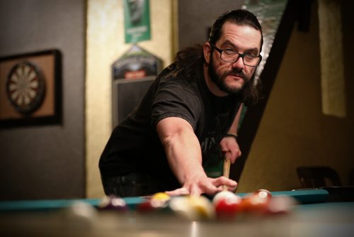 JOHN WOODS / WINNIPEG FREE PRESS Eric Legault plays pool at Shannon's Irish Pub on Carlton Monday, March 13, 2016. Re: Sanderson