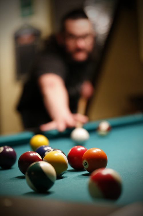 JOHN WOODS / WINNIPEG FREE PRESS Eric Legault plays pool at Shannon's Irish Pub on Carlton Monday, March 13, 2016. Re: Sanderson