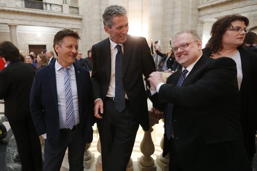 JOHN WOODS / WINNIPEG FREE PRESS PC leader Brian Pallister (C) jokes with incumbents Ron Schuler (L) and Kelvin Goertzen about "hitting it out of the park" after a session to dissolve government and prior to a PC candidate team photo at the Manitoba Legislature Tuesday, March 15, 2016.