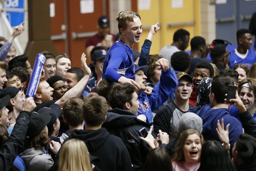 JOHN WOODS / WINNIPEG FREE PRESS Sturgeon Heights Huskies' Riley Pierce (7) and their fans celebrate his  last second point to defeat the Garden City Fighting Gophers  in the Junior Varsity AAAA Boys Basketball Provincial Championship at the University of Manitoba Tuesday, March 15, 2016.