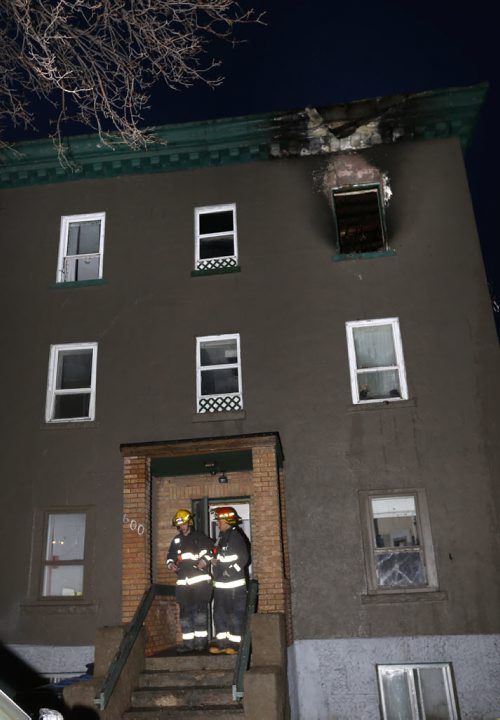 WAYNE GLOWACKI / WINNIPEG FREE PRESS  Winnipeg Fire Fighters at a three storey walk up apartment building in the 600 block of McGee St. Wednesday morningafter an early morning fire.  March 16 2016
