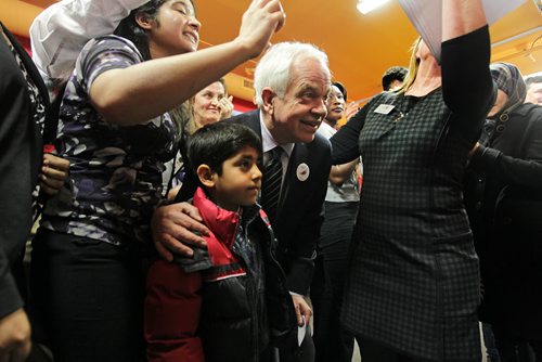 RUTH BONNEVILLE / WINNIPEG FREE PRESS  Minister of Immigration, John McCallum has his picture taken with six-year-old Ahmad El Ahmar from Syria  after a press conference announcing $500 000 for Syrian Refugees Thursday at Welcome Place.   March 17, 2016