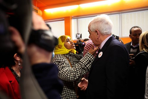 RUTH BONNEVILLE / WINNIPEG FREE PRESS  Minister of Immigration, John McCallum is approached by Farhia Gelle (woman) and her partner Guled Farah (in rear) from Somalia with questions in the middle of a press conference announcing $500 000 for Syrian Refugees Thursday at Welcome Place.  The Somalian's are distraught over issues with CFS and their children and have crashed a few formal engagements in Winnipeg lately to bring their issue to the forefront.  March 17, 2016