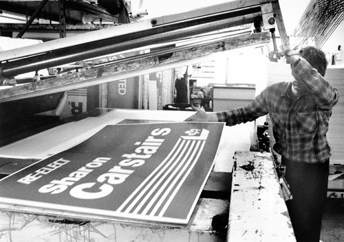 GERRY CAIRNS / WINNIPEG FREE PRESS Print shop employee Allan Thomson pulls the first of many election signs off the press. March 19, 1988 1988 Manitoba Provincial Election