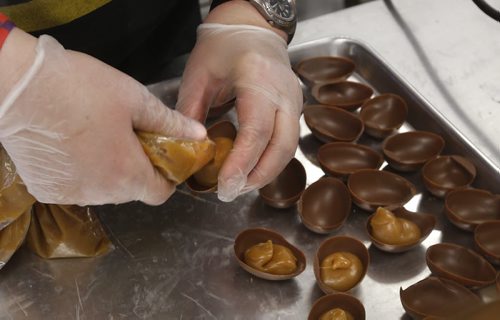 WAYNE GLOWACKI / WINNIPEG FREE PRESS  Decadence Chocolates owner Helen Staines puts caramel in chocolate shells that will have pecans added to become Turtles On The Half Shell.  Gord Sinclair  story March 17 2016