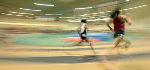 PHIL HOSSACK / WINNIPEG FREE PRESS  TRACK AND FIELD - WOmen in the 200 meter event sprint past the camera in a blur of speed Thursday. MARCH 17, 2016