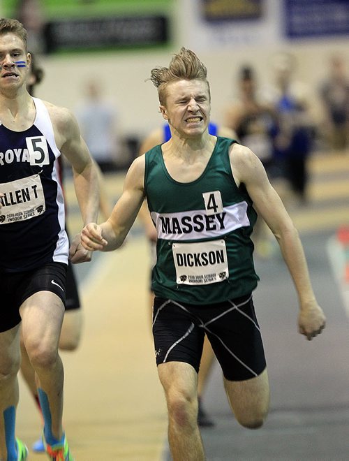 PHIL HOSSACK / WINNIPEG FREE PRESS Vincent Massey's "Dickson" strains across the finish line in the mens 200 meter Thursday at Athletics Manitoba High School Track Event MARCH 17, 2016 Names and rosters were not available, I could not track this kid down to get his first name.