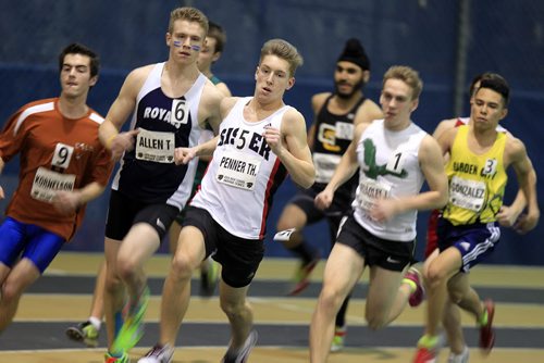 PHIL HOSSACK / WINNIPEG FREE PRESS Led by Sisler's T. Penner, varcity men round the first corner in a pack for the men's 800 meter final Thursday at the Athletics Manitoba Indoor High School meet. See Melissa Martin's story. MARCH 17, 2016