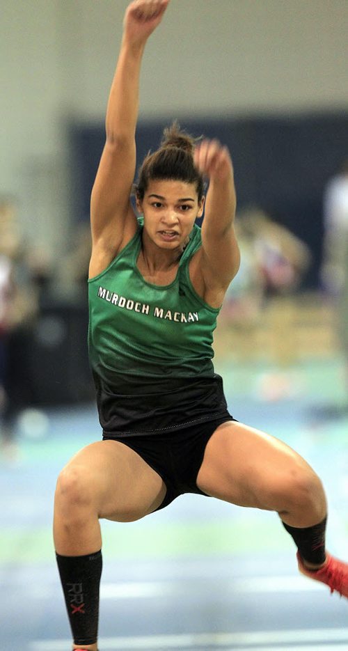 PHIL HOSSACK / WINNIPEG FREE PRESS  TRACK AND FIELD - Rebecca Erchart (sp?) hurtles toward the sand in the triple jump Thursday. See Melissa Martin story. MARCH 17, 2016 Melissa will have this girls name in her story to check the spelling.