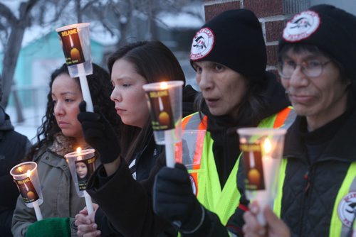 JOE BRYKSA / WINNIPEG FREE PRESS  About 40 people attended a candle light vigil Thursday night at the bell tower on Selkirk Ave to keep missing Kenora 16 year old,  Delaine Copenace i in the public eye- She was last seen in Kenora ,Ontario on Feb 27  - Her cousin Leslie Ross, left, organized the vigil tonight with the Bear Clan Patrol-  March 17, 2016.(See Alex Paul story)Darryl Condois