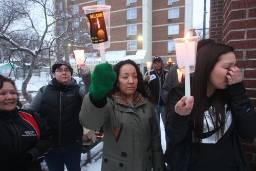 JOE BRYKSA / WINNIPEG FREE PRESS  About 40 people attended a candle light vigil Thursday night at the bell tower on Selkirk Ave to keep missing Kenora 16 year old,  Delaine Copenace i in the public eye- She was last seen in Kenora ,Ontario on Feb 27  - Her cousin Leslie Ross, centre, organized the vigil tonight with the Bear Clan Patrol-  March 17, 2016.(See Alex Paul story)