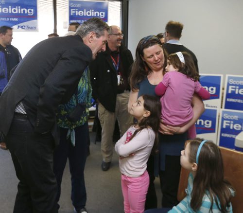 WAYNE GLOWACKI / WINNIPEG FREE PRESS  PC Leader Brian Pallister speaks to Marni Daun and her daughters from left, Lacie,7, Rayna,4, and seated is Livanna,10, about their ambulance dispute prior to his health care announcement. The event took place in candidate Scott Fielding's campaign office Friday morning. ¤ Larry Kusch story  March 18 2016