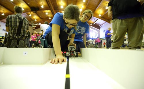 TREVOR HAGAN / WINNIPEG FREE PRESS Amy Sisson and Sydney Capan setup their robot during the 21st annual Manitoba Robot Games, being held at Tec-Voc High School, Saturday, March 19, 2016.