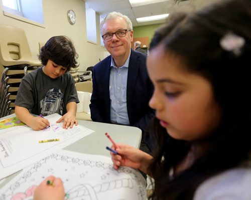 TREVOR HAGAN / WINNIPEG FREE PRESS NDP Leader Greg Selinger with Ronin Husack, 6, left and Talina Husack, 8, at West End Commons after pledging a 50 cent minimum wage increase, Saturday, March 19, 2016.
