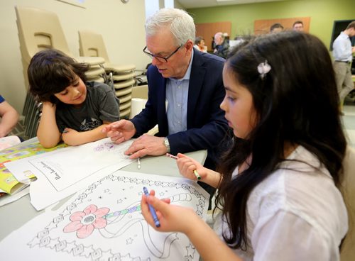 TREVOR HAGAN / WINNIPEG FREE PRESS NDP Leader Greg Selinger with Ronin Husack, 6, left and Talina Husack, 8, at West End Commons after pledging a 50 cent minimum wage increase, Saturday, March 19, 2016.