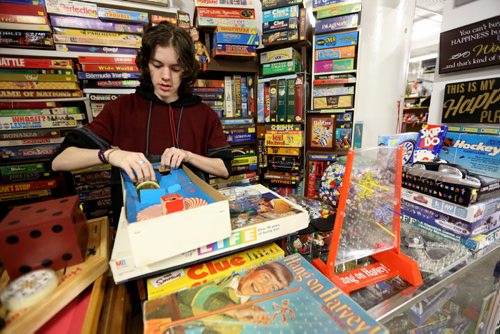 TREVOR HAGAN / WINNIPEG FREE PRESS Tanner, 16, in the Mulvey flea market booth selling games owned by his dad, Rusty , Saturday, March 19, 2016. For Dave Sanderson 49.9 story