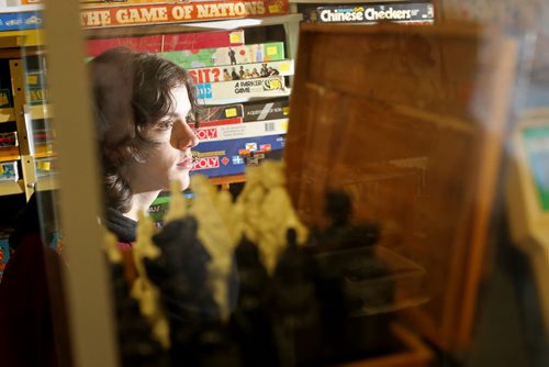 TREVOR HAGAN / WINNIPEG FREE PRESS Tanner, 16, in the Mulvey flea market booth selling games owned by his dad, Rusty , Saturday, March 19, 2016. For Dave Sanderson 49.9 story