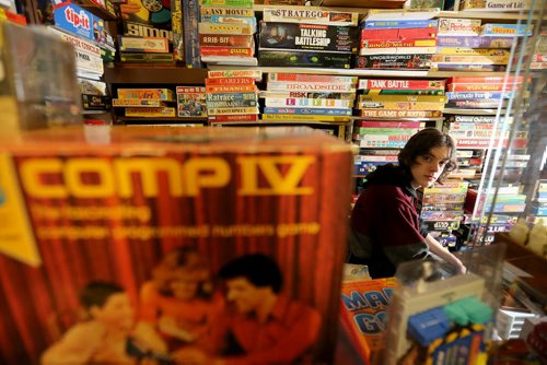TREVOR HAGAN / WINNIPEG FREE PRESS Tanner, 16, in the Mulvey flea market booth selling games owned by his dad, Rusty , Saturday, March 19, 2016. For Dave Sanderson 49.9 story