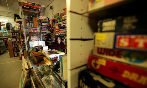 TREVOR HAGAN / WINNIPEG FREE PRESS Tanner, 16, in the Mulvey flea market booth selling games owned by his dad, Rusty , Saturday, March 19, 2016. For Dave Sanderson 49.9 story