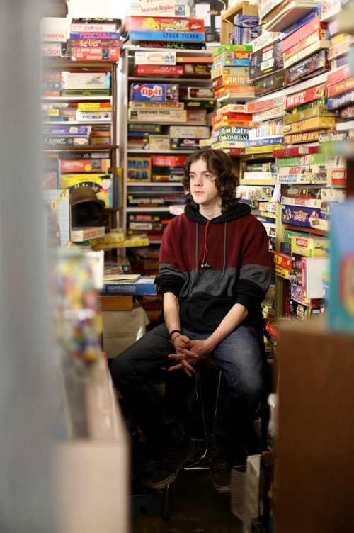 TREVOR HAGAN / WINNIPEG FREE PRESS Tanner, 16, in the Mulvey flea market booth selling games owned by his dad, Rusty , Saturday, March 19, 2016. For Dave Sanderson 49.9 story