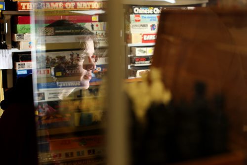 TREVOR HAGAN / WINNIPEG FREE PRESS Tanner, 16, in the Mulvey flea market booth selling games owned by his dad, Rusty , Saturday, March 19, 2016. For Dave Sanderson 49.9 story