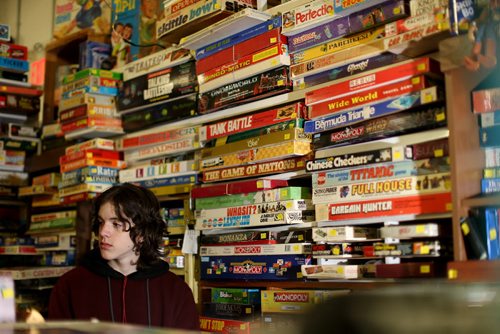 TREVOR HAGAN / WINNIPEG FREE PRESS Tanner, 16, in the Mulvey flea market booth selling games owned by his dad, Rusty , Saturday, March 19, 2016. For Dave Sanderson 49.9 story