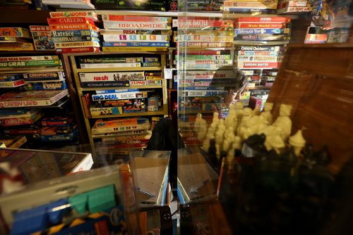 TREVOR HAGAN / WINNIPEG FREE PRESS Tanner, 16, in the Mulvey flea market booth selling games owned by his dad, Rusty , Saturday, March 19, 2016. For Dave Sanderson 49.9 story