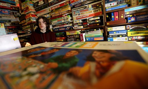 TREVOR HAGAN / WINNIPEG FREE PRESS Tanner, 16, in the Mulvey flea market booth selling games owned by his dad, Rusty , Saturday, March 19, 2016. For Dave Sanderson 49.9 story