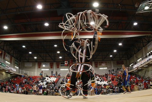 JOHN WOODS / WINNIPEG FREE PRESS Ryan Runearth performs a hoop dance at the University of Winnipeg's annual spring powwow in Winnipeg Saturday, March 19, 2016.